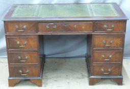 Twin pedestal leather inset desk with nine drawers, W121 x D62 x H75cm