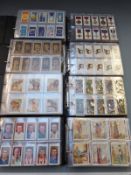 Eight albums of cigarette and similar cards to include association footballers, footballers 1929,