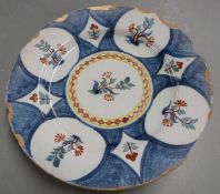 An 18thC Delft plate with polychrome decoration, diameter 23cm