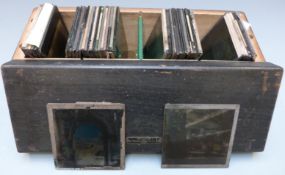 Approximatley forty glass photographic slides including sailing boats, fishing village,