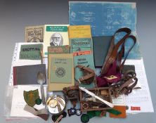 A collection of Scouting movement memorabilia comprising cloth and metal badges including an early