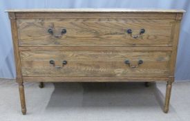 Three pieces of oak furniture including two drawer chest of drawers and a pair of tables with