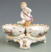 A late 19th/20thC Berlin figural putti double salt/sweetmeat dish decorated with birds and