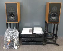 Cambridge Audio azur stacking audio system with a pair of speakers in teak cabinets on stands