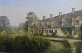 E.J Wilson oil on board Arlington Row, Bibury, Cotswold village scene, signed lower right and titled