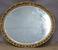 Oval gilt framed mirror, overall height 68cm