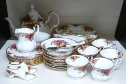 Approximately thirty four pieces of Royal Albert Old Country Roses dinner and tea ware