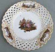A 19thC Meissen pierced cabinet plate decorated with Watteau scenes, diameter 24cm