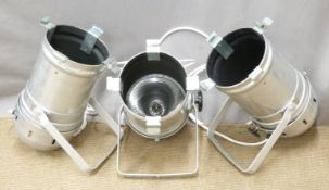 Three polished aluminium stage/industrial lights