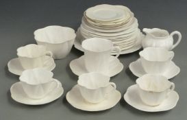 Approximately 32 Shelley and Foley tea ware with moulded leaf decoration, reg no 272101