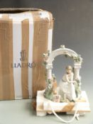 Lladro figurine seated beneath an arbour with dog 