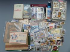 Large collection of cigarette and trade cards, loose and in albums including Wills, Players, Walt