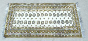Gold and cream Turkoman rug 208 x 100cm