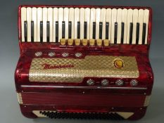 Marinucci 120 bass piano accordion with six treble couplers and one bass coupler, in red pearloid