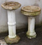 Two garden bird baths with fluted column supports, height of taller 75cm