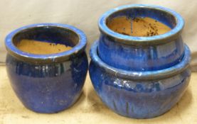 Three blue glazed garden plant pots, diameter of largest 45cm