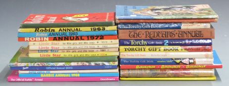 Twenty-seven children’s annuals including, Little Star, Barbie, The Torchy Gift, Banana man, etc.