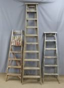 Three vintage wooden step ladders, tallest 230cm