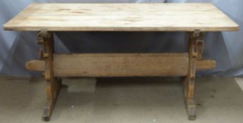Pine rustic table raised on sleigh type legs united by stretcher, L163 x D89 x H76cm