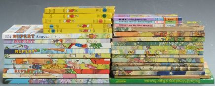 Thirty-one Rupert annuals and books.