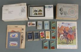 A collection of first day covers and cigarette cards