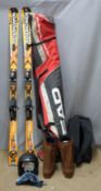 Pair of Rossignol skis together with a pair of boots, helmet and travel bags