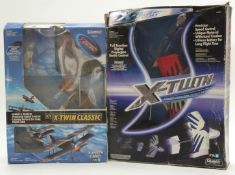 Two Silverlit X-Twin radio controlled model aeroplanes, both in original boxes.