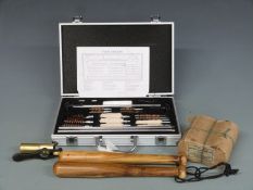 A twenty-four piece shotgun and rifle cleaning kit in fitted case together with a brass shotgun