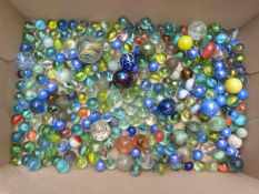 Collection of vintage glass marbles including some with multi-coloured twists, largest 34mm in