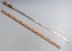 Japanese sword or swordstick with dragon decorations to the bronze fittings, leather handle,