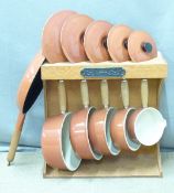 Le Creuset saucepan set with branded hanging wooden rack and additional frying pan, saucepan sizes