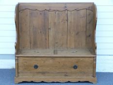 A pine settle with storage under, W120 x D41 x H116cm