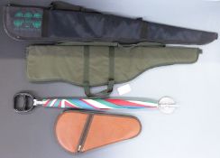 Two shotgun or rifle slips together with a pistol or revolver slip and a shooting stick umbrella.