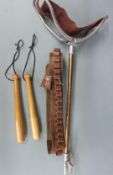 A vintage shooting stick together with a brown leather 12 bore shotgun cartridge belt and a wooden