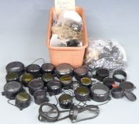 A large collection of scope mounts of various sizes together with a collection of scope covers.