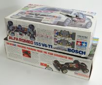 Two 1:10 scale remote controlled model car kits Tamiya Alfa Romeo 155 V6 TI Bosch 58195 and Team