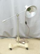 A retro Sol-Tan heat lamp with cast iron base