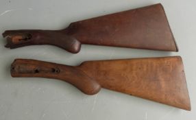 Three wooden shotgun stocks with chequered grips, two semi-pistol grip and two with inlaid vacant