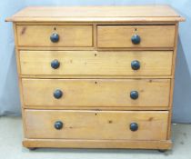 19thC pine chest of two over three graduated drawers raised on bun feet, W109 x D52 x H96.5cm