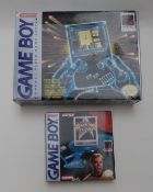 Nintendo Game Boy hand held video games console, in original box together with three games Star Trek