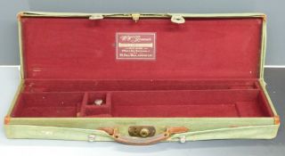 W W Greener leather bound shotgun carry case with fitted interior, oil bottle, fitted canvas cover