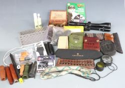 A collection of gun and shooting accessories including Nikko Sterling Silver Crown 4x40 scope,