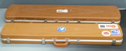 Two Gun Guard rifle flight carry cases with locks and padded interiors, 134x30x11cm and 125x24x11cm.