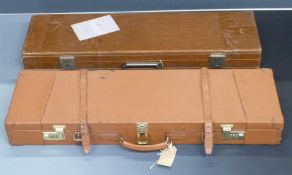 Two shotgun carry cases one with coded locks and fitted interior (80x25x10) the other with padded