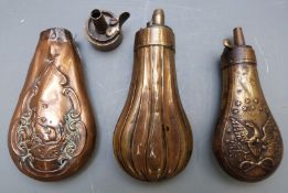 Three small copper and brass pistol or revolver powder flasks, two with embossed decoration and