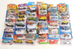 Forty Siku, Matchbox, Hotwheels and Corgi diecast model vehicles, all in original blister packs.