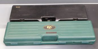 Two shotgun carry cases both with fitted interiors, 78x25x8cm and 82x29x11cm.