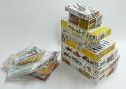 Eighteen Airfix, Tamiya, Italeri, Heller and similar plastic model kits including Universal