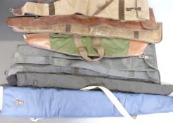 Nine various shotgun or rifle gun slips all with shoulder straps, some with padded interiors.