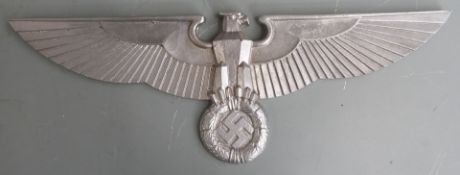 Three replica Nazi German cast aluminum eagle and swastikas, width of largest 73cm